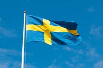 Swedish flag on a flagpole.