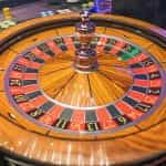 A roulette wheel spins.